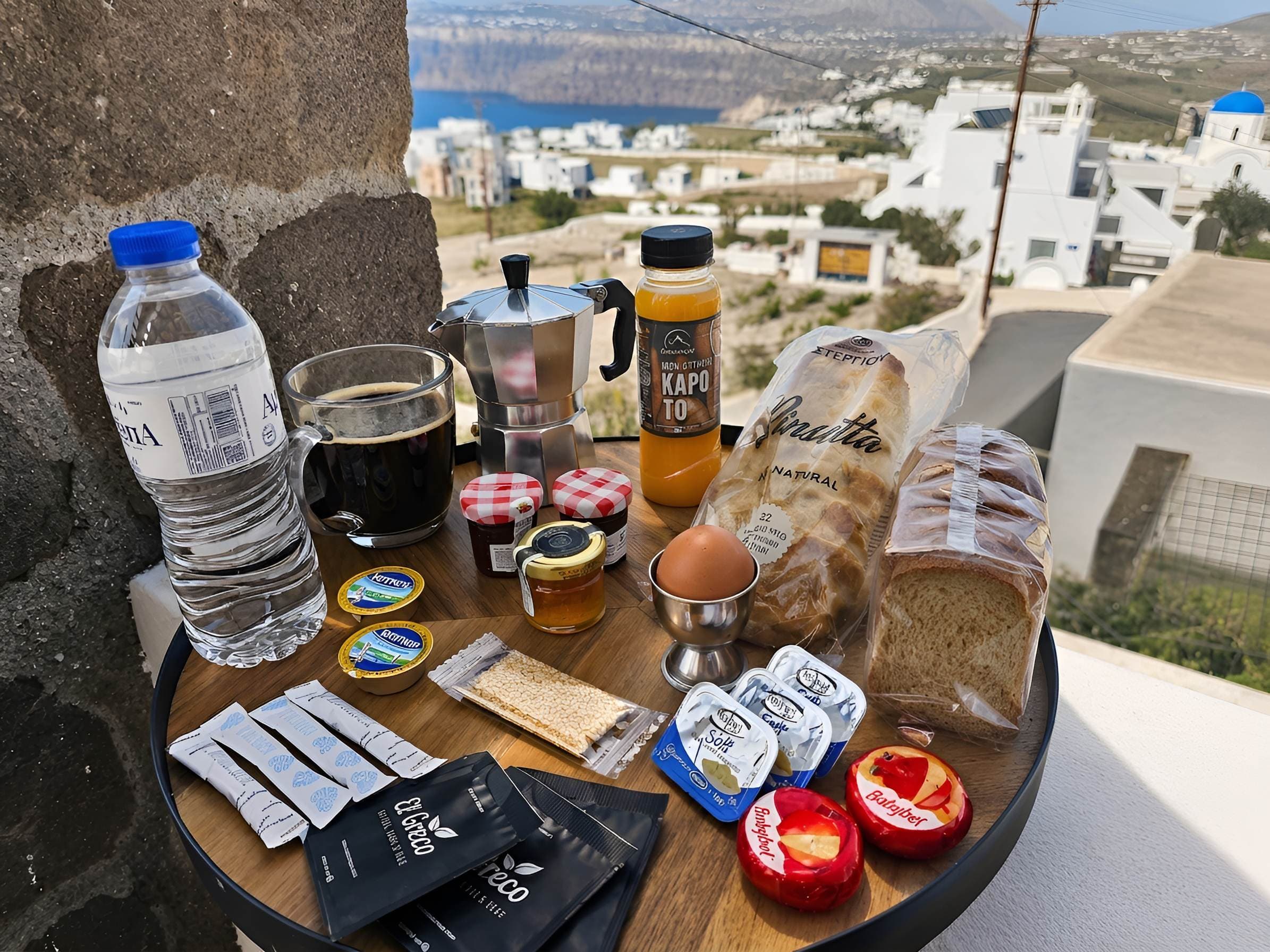 Greek breakfast tray with coffee, fresh bread, and local products